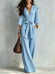 Damen Jumpsuit Wickel-Optik mit weitem Bein, Taillengürtel und Glockenärmeln Nord Taschen – Himmelblau