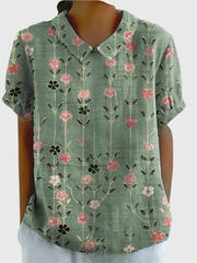 Kurzärmelige Damenbluse mit Blumenmuster und Bubikragen – Salbeigrün